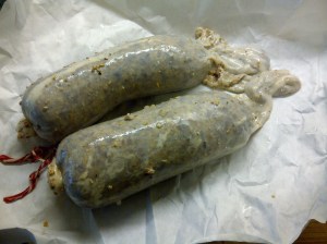 Casings stuffed halfway and ready to be tied off.